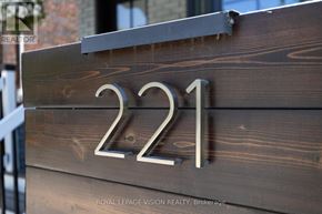 Toronto (Lawrence Park North) apartment for rent - A wooden sign with the number 221 on it.