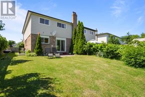 Mississauga (Cooksville) apartment for rent - A house with a lawn in front of it.