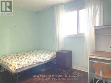 Toronto (Bayview Woods-Steeles) apartment for rent - A bedroom with a bed, desk, and chair.