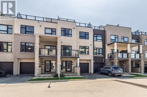 Burlington (Lasalle) townhouse for rent - A modern apartment building with balconies and garages is shown.