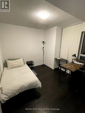 Toronto (Church-Yonge Corridor) condo for rent - A bedroom with a bed, nightstand, and desk.