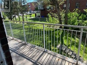Toronto (Stonegate-Queensway) condo for rent - A white metal fence with a sign that says "REALTOR" on it.