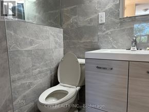 Toronto (Stonegate-Queensway) condo for rent - A bathroom with a toilet and a sink.