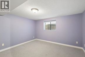 Vancouver apartment for rent - A room with purple walls and a window with blinds.