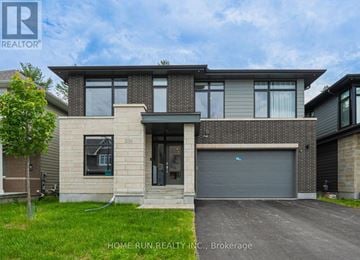 Ottawa apartment for rent - A modern house with a garage is for sale.