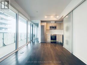 Toronto (Church-Yonge Corridor) condo for rent - A spacious kitchen with wooden floors and a large window.
