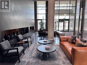 Vaughan (Vaughan Corporate Centre) condo for rent - A waiting area with leather couches and chairs.