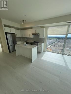 Vaughan (Vellore Village) condo for rent - A modern kitchen with a view of the city.