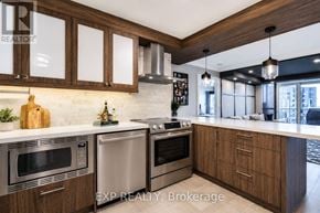 Markham (Unionville) condo for rent - A modern kitchen with wooden cabinets and stainless steel appliances.
