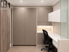 Markham (Unionville) condo for rent - A room with a desk, chair, and cabinets.