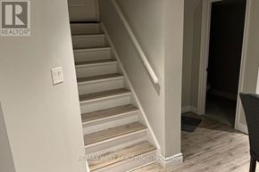 Richmond Hill (Oak Ridges Lake Wilcox) apartment for rent - A staircase with a light switch on the wall.