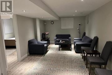 Richmond Hill (Oak Ridges Lake Wilcox) apartment for rent - A living room with a grey sofa and black chairs.