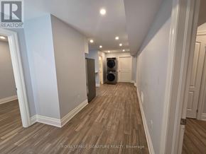 Toronto (Downsview-Roding-Cfb) apartment for rent - A hallway with wood flooring and white walls.