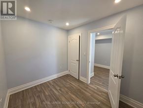 Toronto (Downsview-Roding-Cfb) apartment for rent - A room with a white door and a white wall.