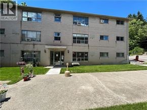Dundas apartment for rent - A building with the word REALTOR on the top left corner.