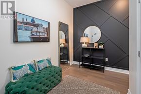 Guelph (Pineridge/Westminster Woods) condo for rent - A living room with a green couch and a painting on the wall.