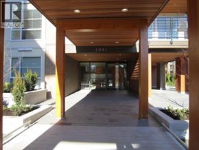Vancouver apartment for rent - The image shows a modern building entrance with a wooden roof and glass doors.