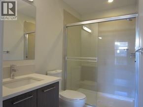 Vancouver apartment for rent - A bathroom with a toilet, sink, and shower.
