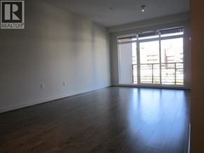 Vancouver apartment for rent - A large empty room with wooden floors and a window with blinds.