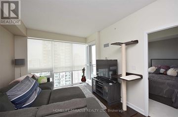 Mississauga (Creditview) condo for rent - A living room with a grey couch and a television on a stand.