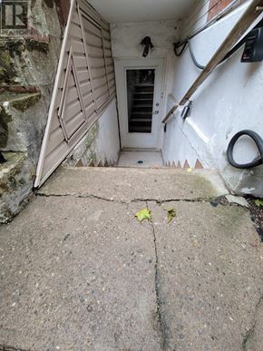 Toronto (Oakwood Village) apartment for rent - A stone staircase leads to a door in a white building.