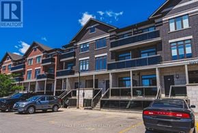 Burlington (Brant) townhouse for rent - A building with a car parked in front of it.
