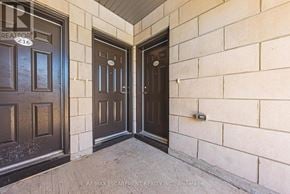 Burlington (Brant) townhouse for rent - A brown door is on the left and a black door is on the right.
