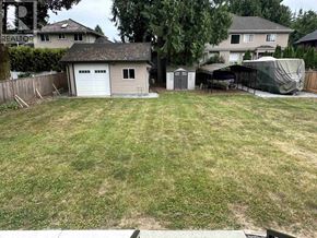 Maple Ridge apartment for rent - A backyard with a shed and a covered patio area.