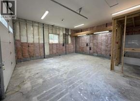 Maple Ridge apartment for rent - A room under construction with exposed walls and a concrete floor.
