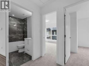 Richmond townhouse for rent - A bathroom with a walk-in shower and a toilet.