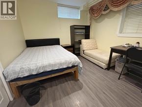 Vancouver apartment for rent - A bedroom with a bed, desk, and chair.