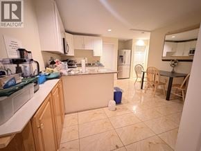 Vancouver apartment for rent - A kitchen with a counter and a fridge.