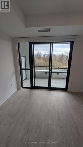 Milton (Cb Cobban) condo for rent - A room with a sliding glass door leading to a balcony.