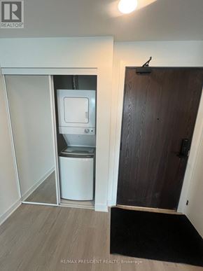Hamilton (Riverdale) condo for rent - A small bathroom with a toilet and a sink.