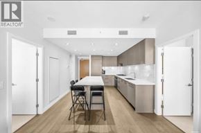 Vancouver apartment for rent - A modern kitchen with a dining table and chairs.