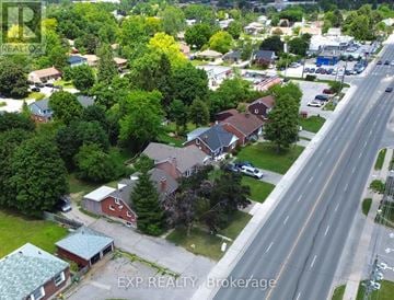 London East (East C) triplex for rent - A real estate company logo is on a picture of a neighborhood.