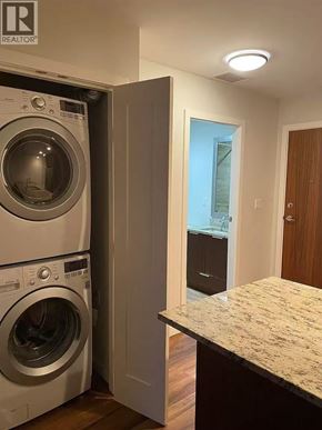 Richmond apartment for rent - A washer and dryer in a small laundry room.