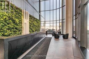 Toronto (Waterfront Communities) condo for rent - A modern interior space with a green wall and black and white decor.
