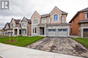 Toronto (Hillcrest Village) apartment for rent - A large, multi-level house with a driveway in front.