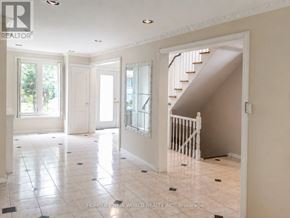Toronto (Hillcrest Village) apartment for rent - A room with white tiled floors and a staircase.