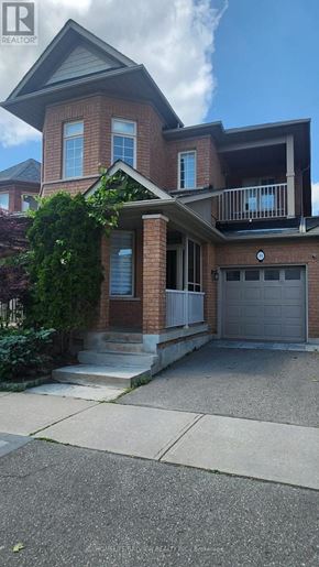 Richmond Hill (Oak Ridges) apartment for rent - A two-story house with a garage and a balcony.