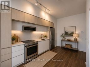 Vaughan (Vaughan Corporate Centre) condo for rent - A modern kitchen with a refrigerator, oven, and sink.