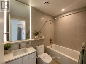 Vaughan (Vaughan Corporate Centre) condo for rent - A bathroom with a white sink, toilet, and bathtub.