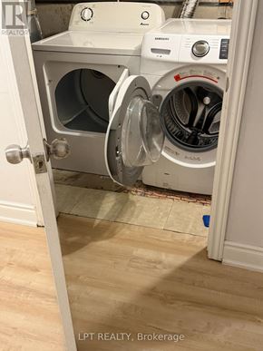 Mississauga (Churchill Meadows) apartment for rent - A white washing machine and dryer are in a small laundry room.