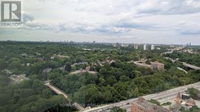 Toronto (North St. James Town) condo for rent - A realtor logo is superimposed on a cityscape.