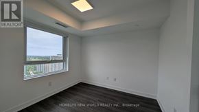 Toronto (North St. James Town) condo for rent - A room with a window and a sign that says "REALTOR".