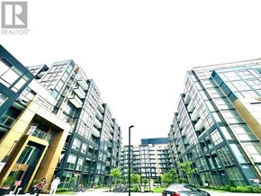 Oakville (Wm Westmount) condo for rent - A modern apartment complex with glass facades and people walking around.