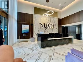 Oakville (Wm Westmount) condo for rent - A reception area with a marble floor and a reception desk with the word "NUVO" on it.