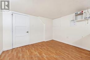 Whitby (Williamsburg) apartment for rent - A room with a white door and wooden flooring.