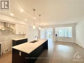 Ottawa townhouse for rent - A modern kitchen with a sink and cabinets.
